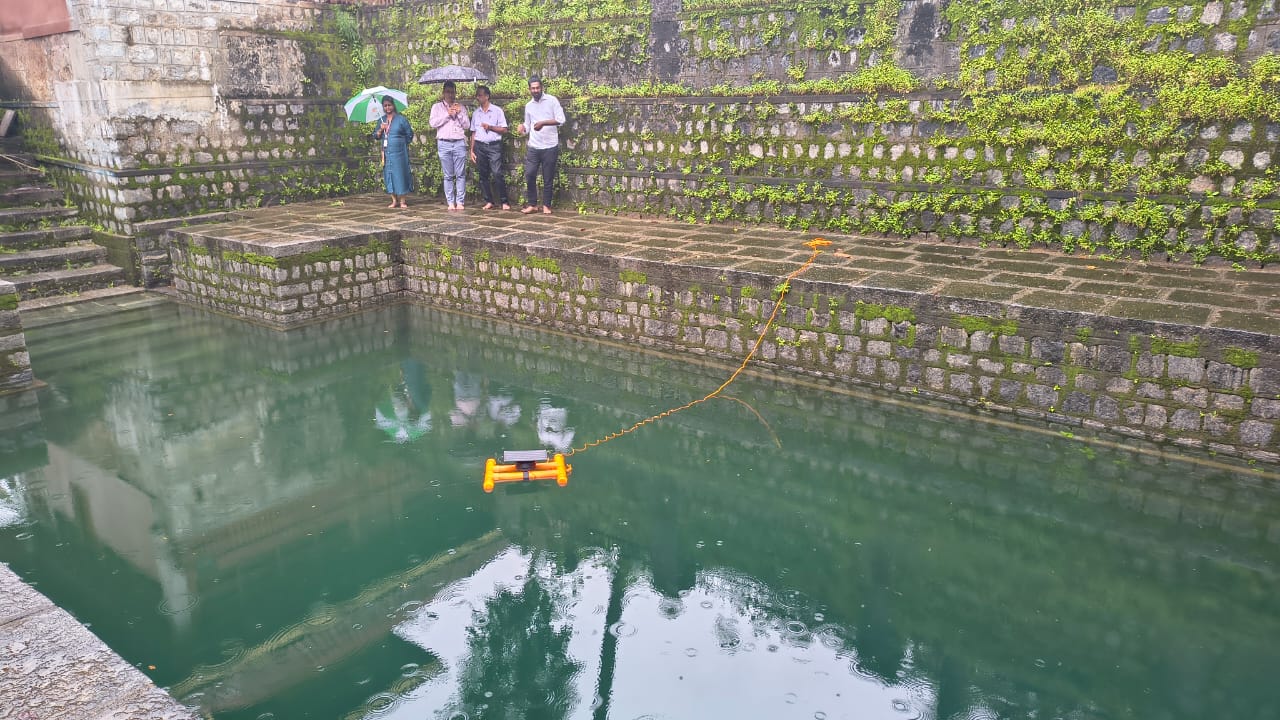 Wide view of Jalio pod deployed in reservoir with team