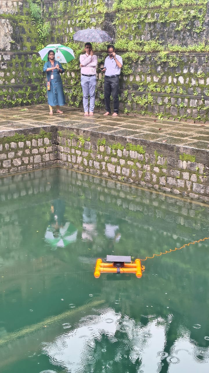 Team observing deployed Jalio pod in stone reservoir